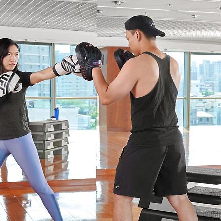 Windsor Hotel Taichung Exterior photo A woman and a man training in a gym